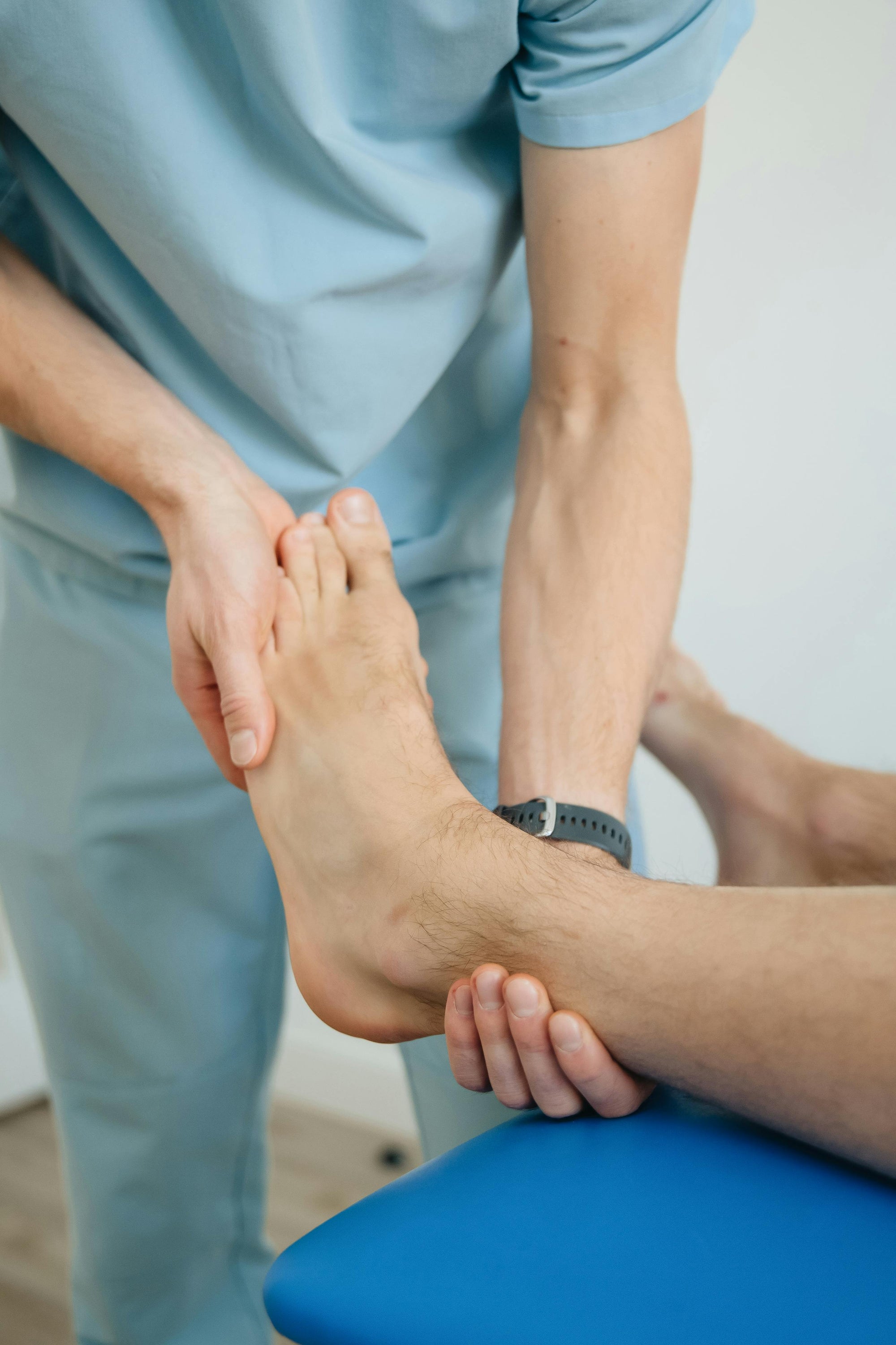 Physiotherapist treating ankle and foot injury at CoreFlex Physio and Rehab Woodbridge